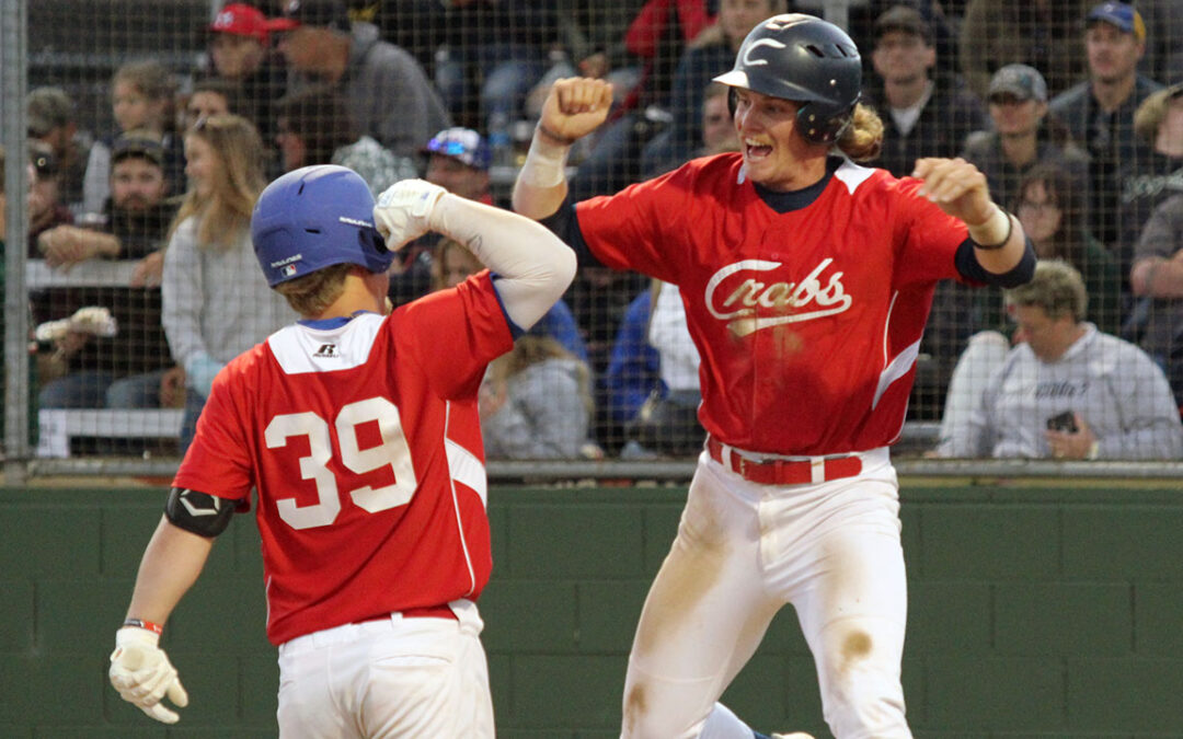 Aidan Morris is high-fived by a teammate after his home run on Tuesday.